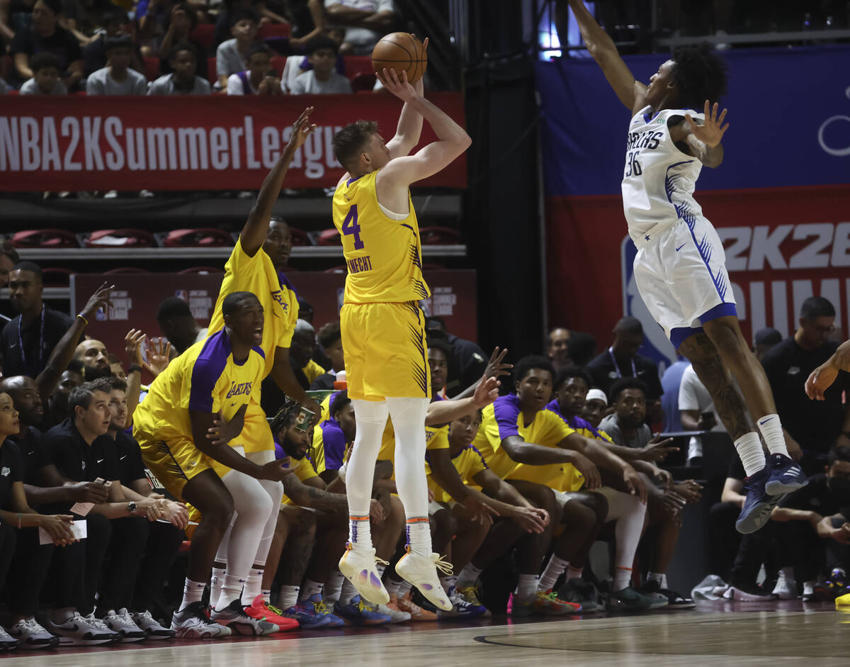Los Angeles Lakers guard Dalton Knecht (4) shoots against Dallas Mavericks forward Maxwell Lewi ...