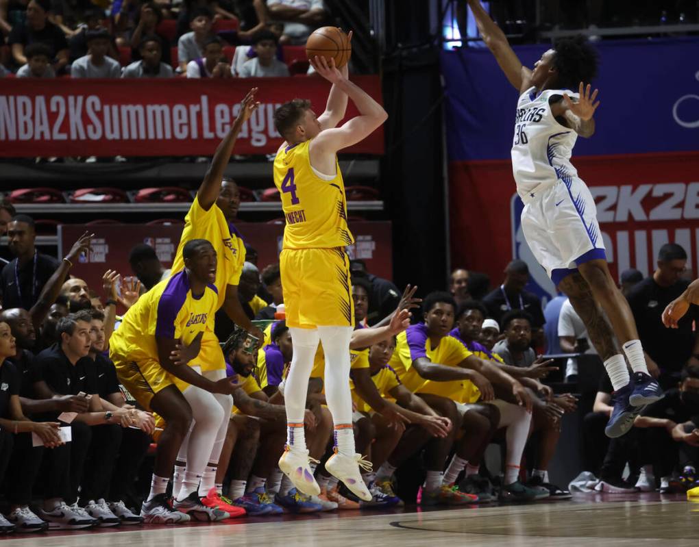 Los Angeles Lakers guard Dalton Knecht (4) shoots against Dallas Mavericks forward Maxwell Lewi ...