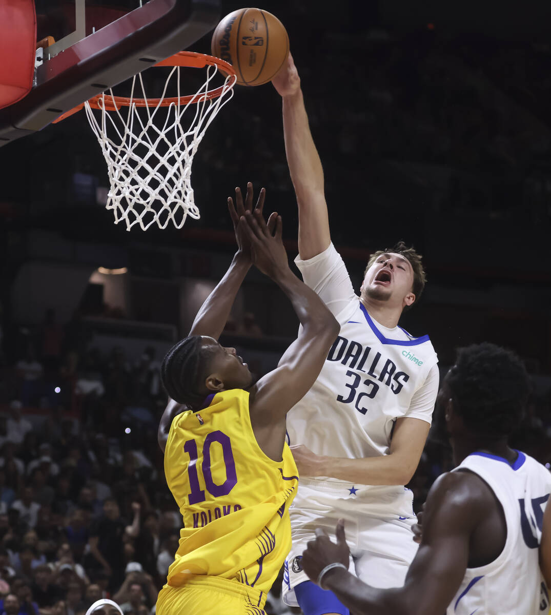 Los Angeles Lakers center Christian Koloko (10) blocks Dallas Mavericks Cooper Flagg (32) at th ...