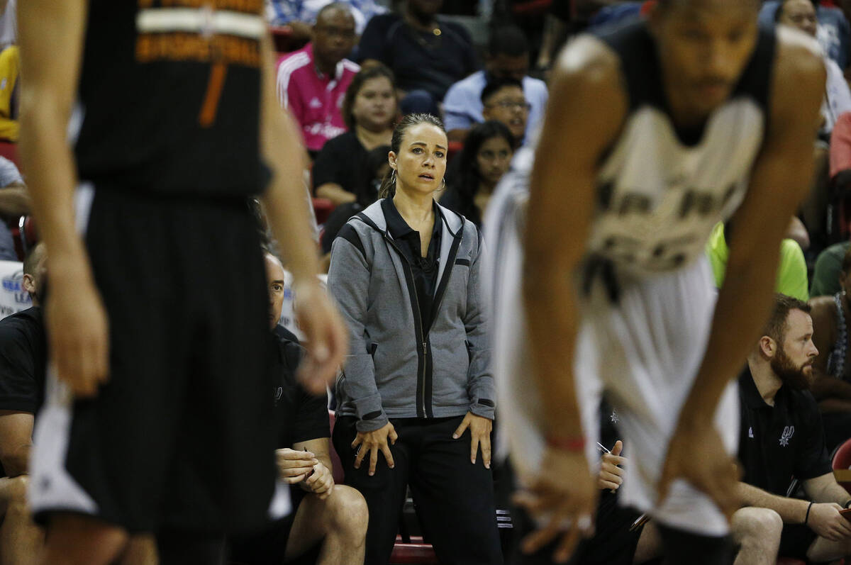 Becky Hammon coaches the San Antonio Spurs against the Phoenix Suns during the first half of an ...