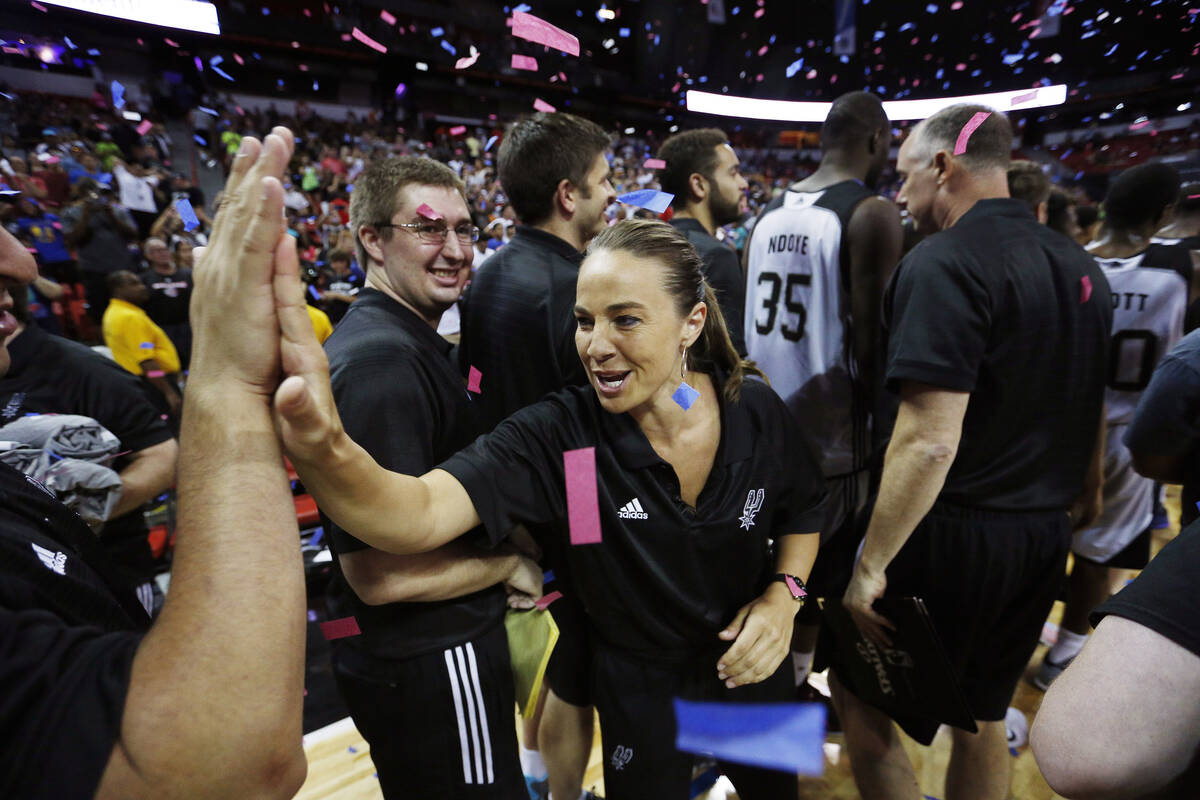 San Antonio Spurs coach Becky Hammon celebrates with her team after they defeated the Phoenix S ...