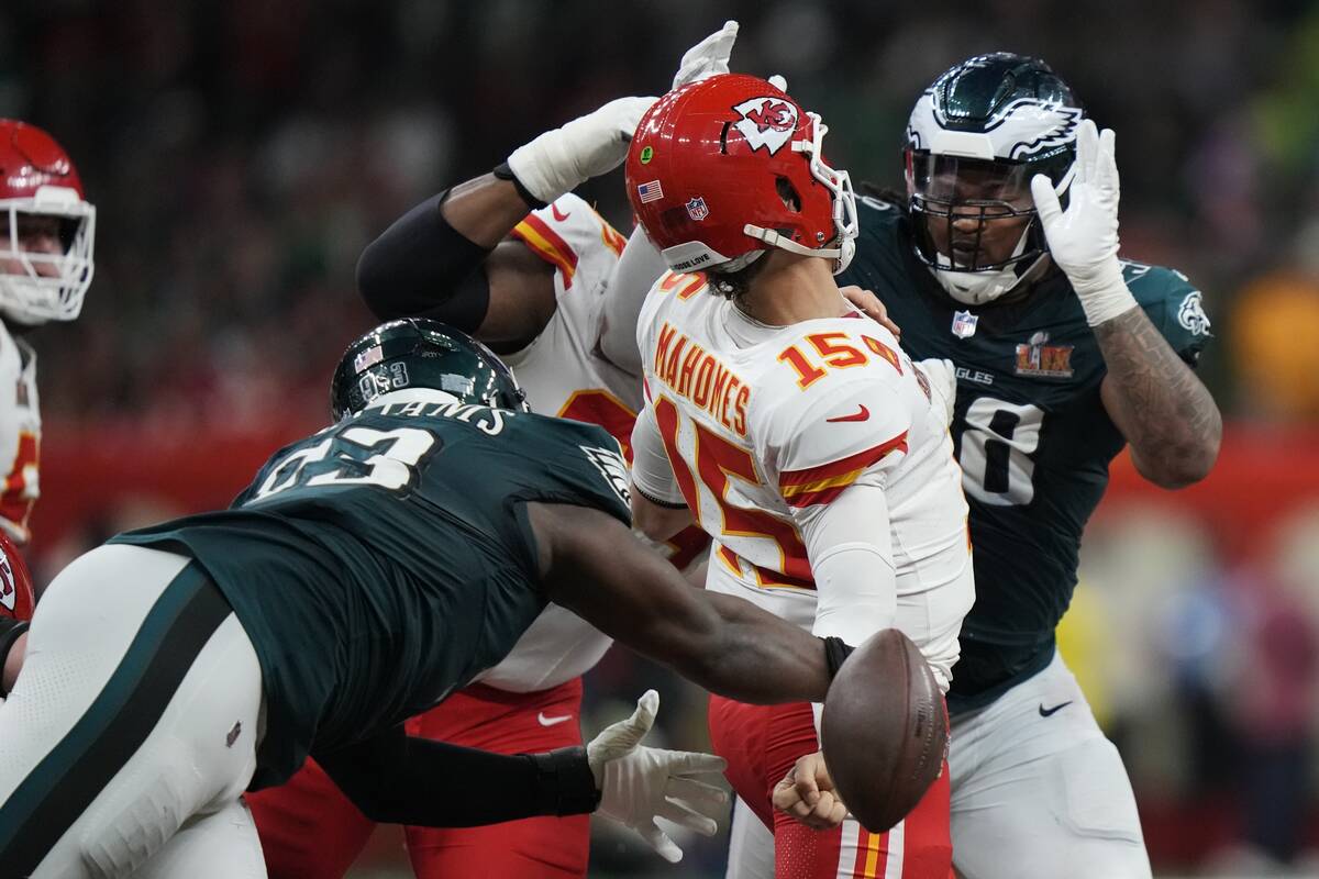 Philadelphia Eagles defensive tackle Milton Williams (93) strips the ball from Kansas City Chie ...