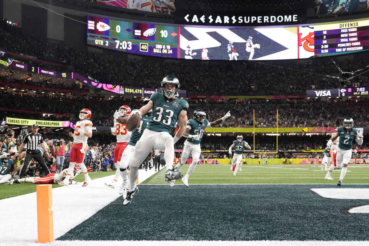 Philadelphia Eagles defensive back Cooper DeJean (33) celebrates after intercepting a pass and ...