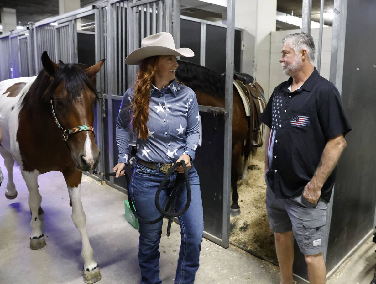 Heidi Brown, a local competing in the Mustang Challenge competition, and her bay pinto mustang, ...