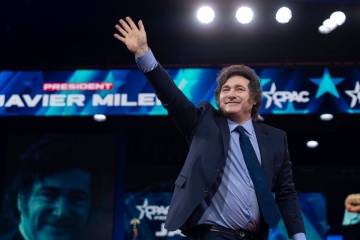 Argentina's President Javier Milei waves to the crowd before speaking at the Conservative Polit ...