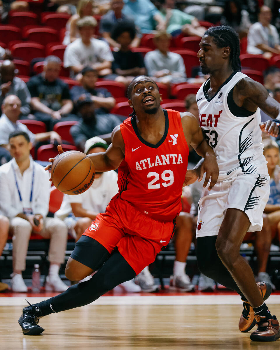 Atlanta Hawks guard Adam Flagler (29) dribbles against Miami Heat guard Kira Lewis Jr. (53) dur ...