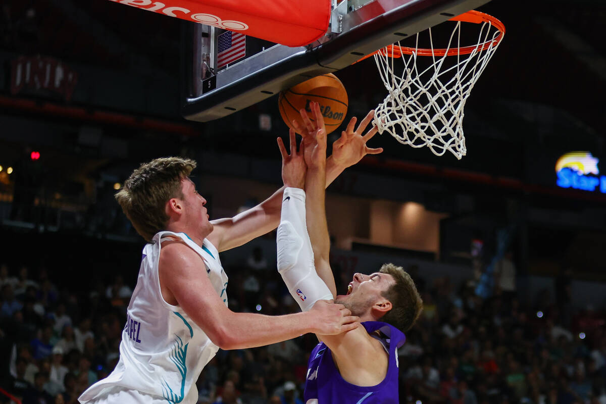 Charlotte Hornets guard/forward Kon Knueppel (7) fouls against Utah Jazz forward Kyle Filipowsk ...