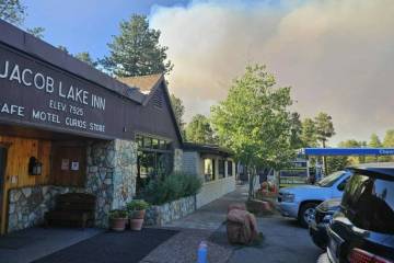 This photo shows smoke from a wildfire behind the Jacob Lake Inn in Jacob Lake, Ariz., on Thurs ...