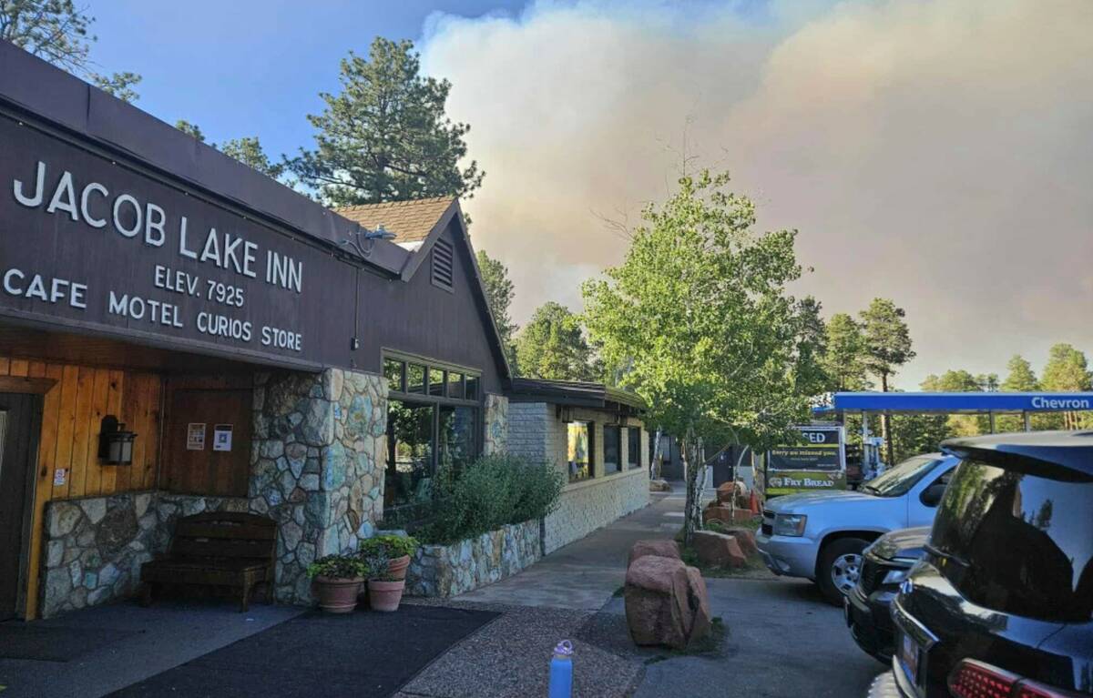 This photo shows smoke from a wildfire behind the Jacob Lake Inn in Jacob Lake, Ariz., on Thurs ...