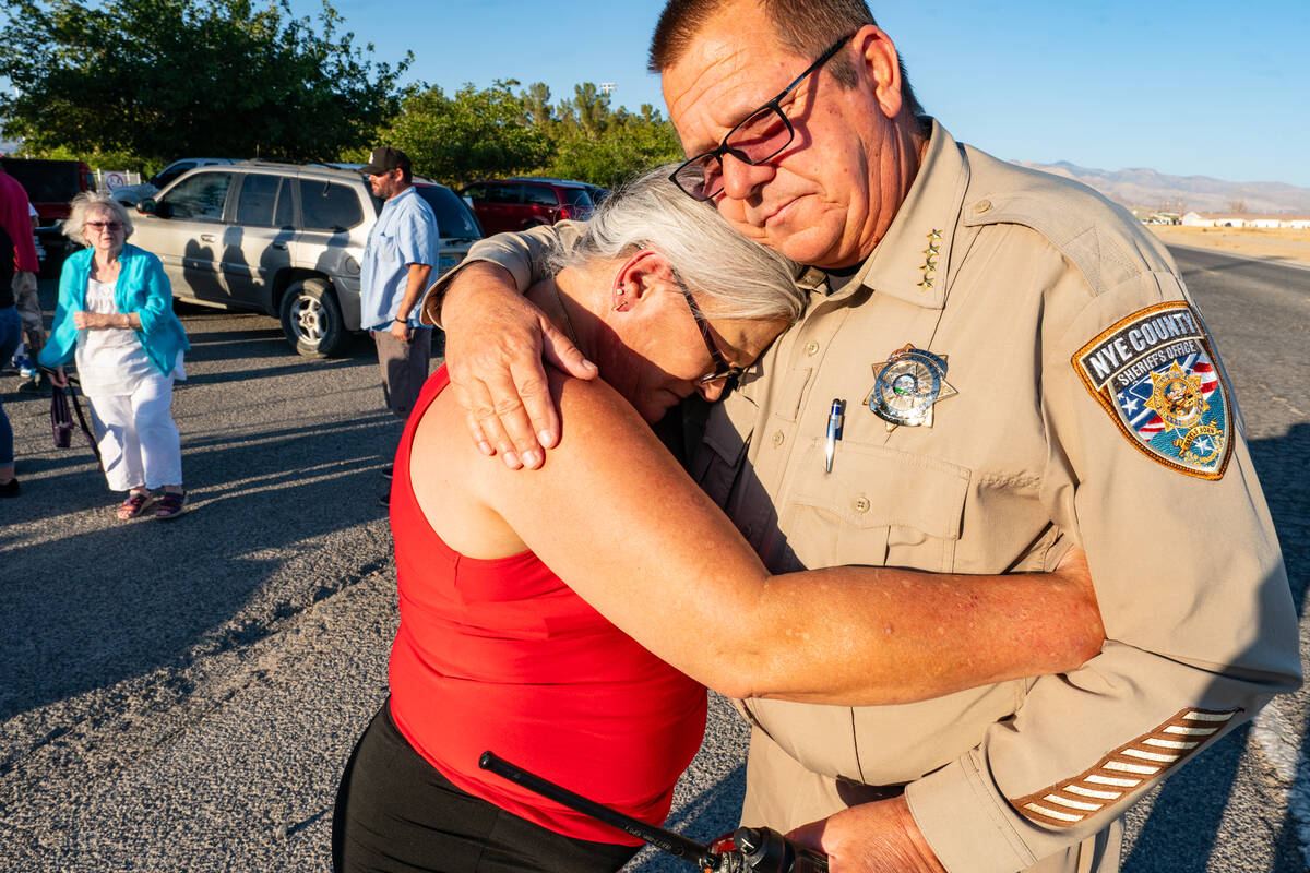 Mari Ausiello, mother of slain Joey Perry, gives Nye County Sheriff Joe McGill a hug and thank ...