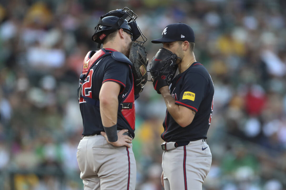 Atlanta Braves catcher Sean Murphy, left, and pitcher Spencer Strider, right, talk during the f ...