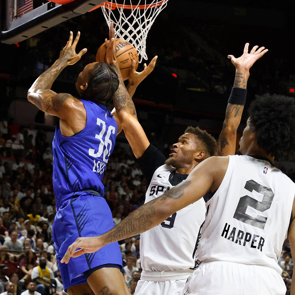 Dallas Mavericks forward Maxwell Lewis (36) shoots over San Antonio Spurs' guards Dexter Dennis ...