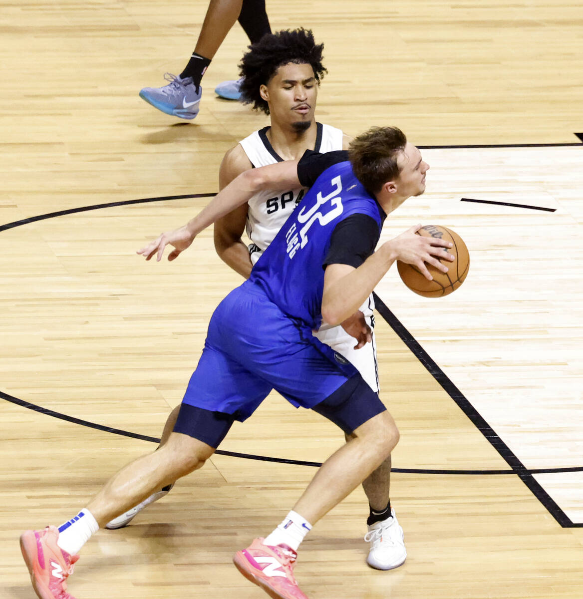 San Antonio Spurs' guard Dylan Harper (2) defends Dallas Mavericks' forward Cooper Flagg (32) d ...