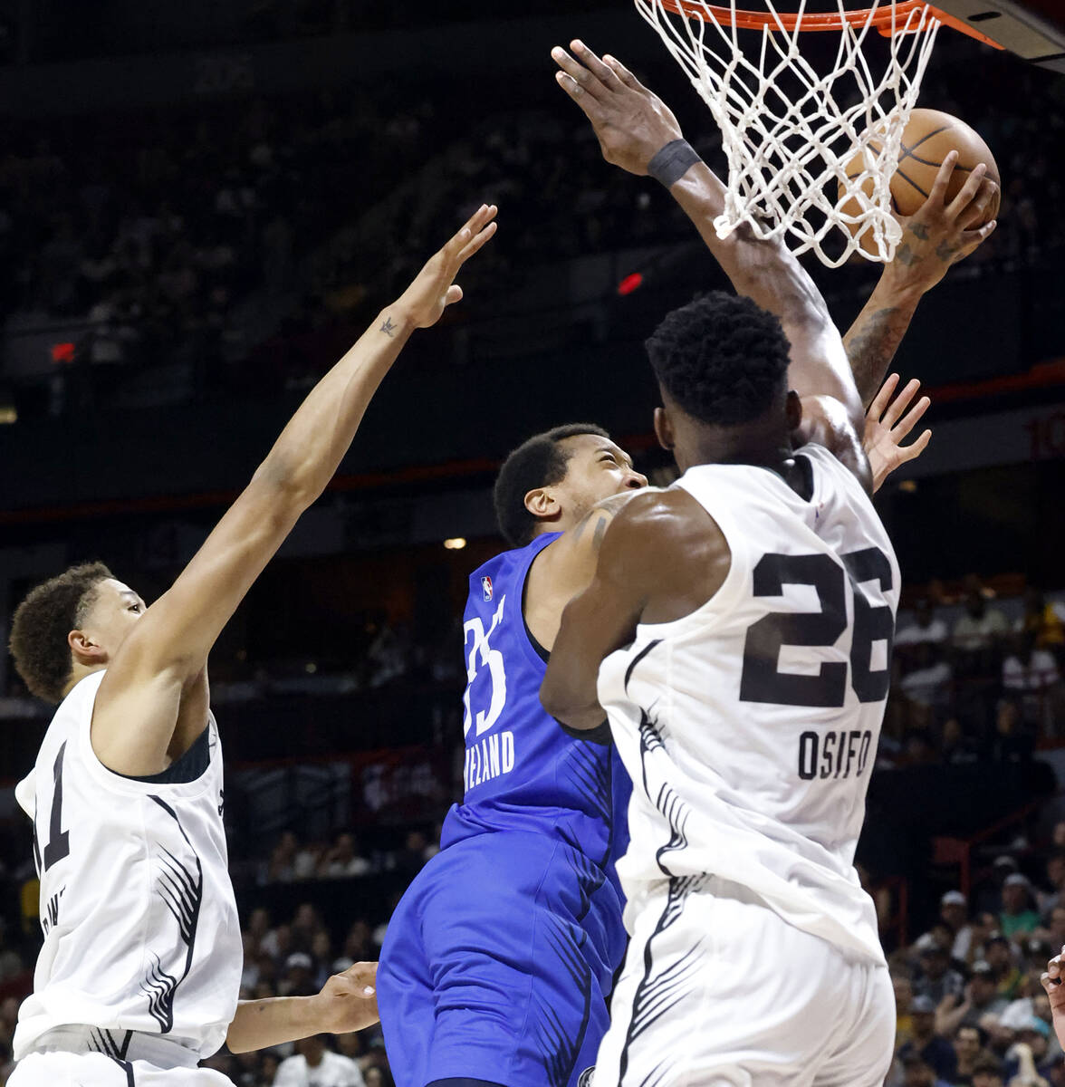 Dallas Mavericks' forward Matthew Cleveland (35) shoots over San Antonio Spurs' forward Osayi O ...