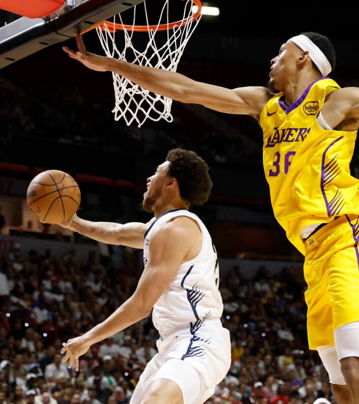 New Orleans Pelicans guard Lester Quinones', left, shoots around Los Angeles Lakers forward Dar ...