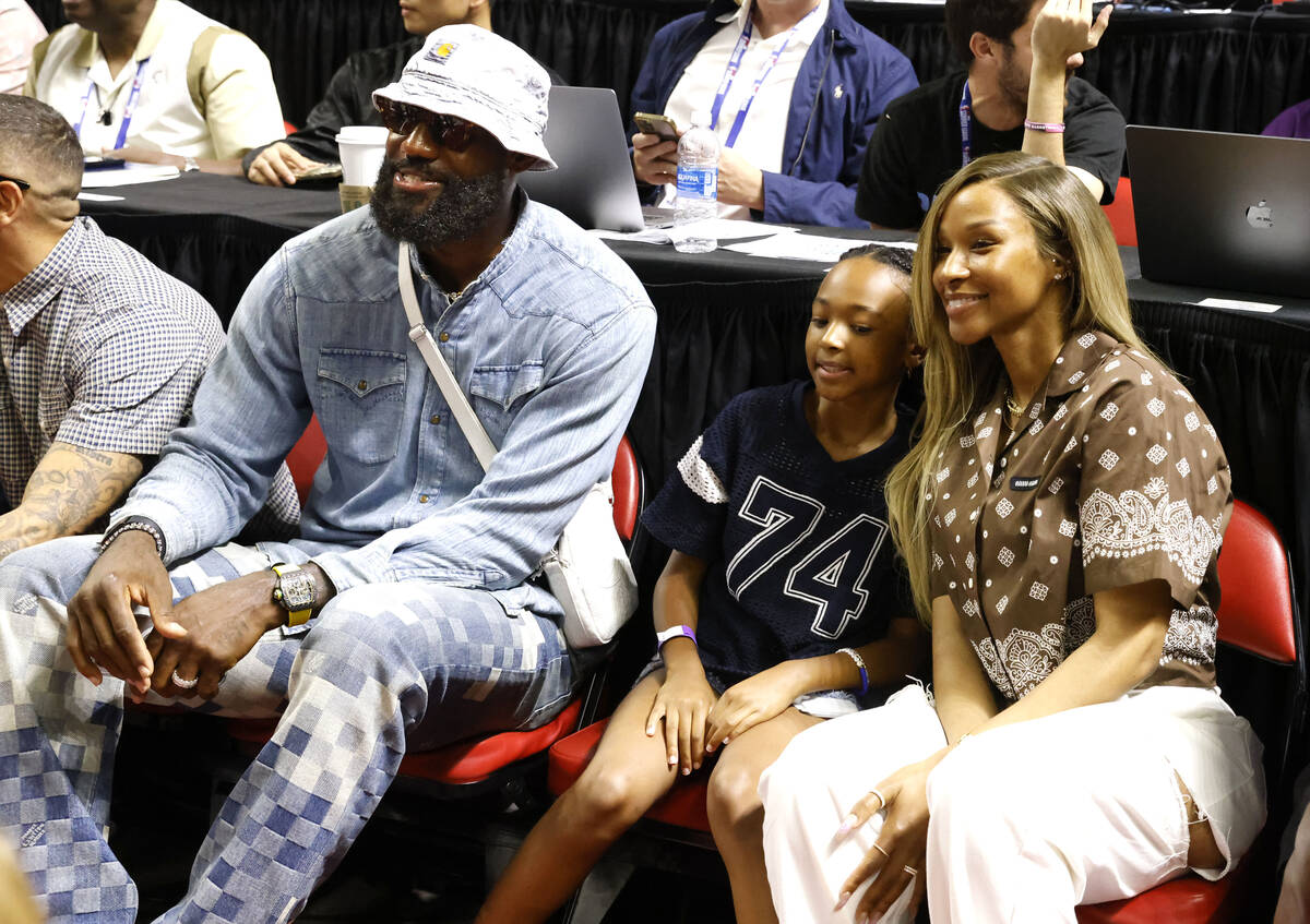Los Angeles Lakers forward LeBron James, his wife Savannah and daughter Zhuri, center, attend t ...