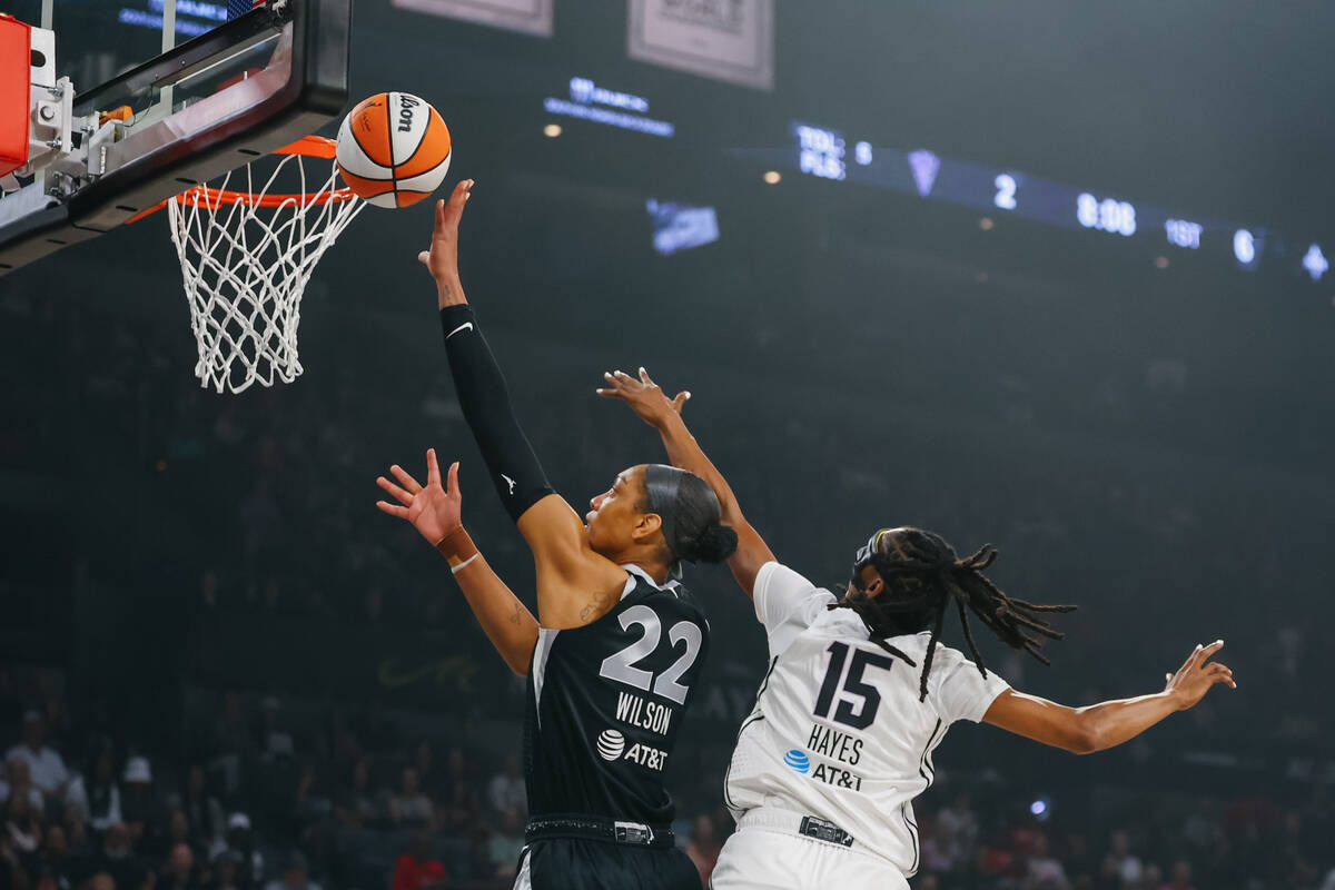 Las Vegas Aces center A'ja Wilson (22) makes a layup as Golden State Valkyries guard Tiffany Ha ...