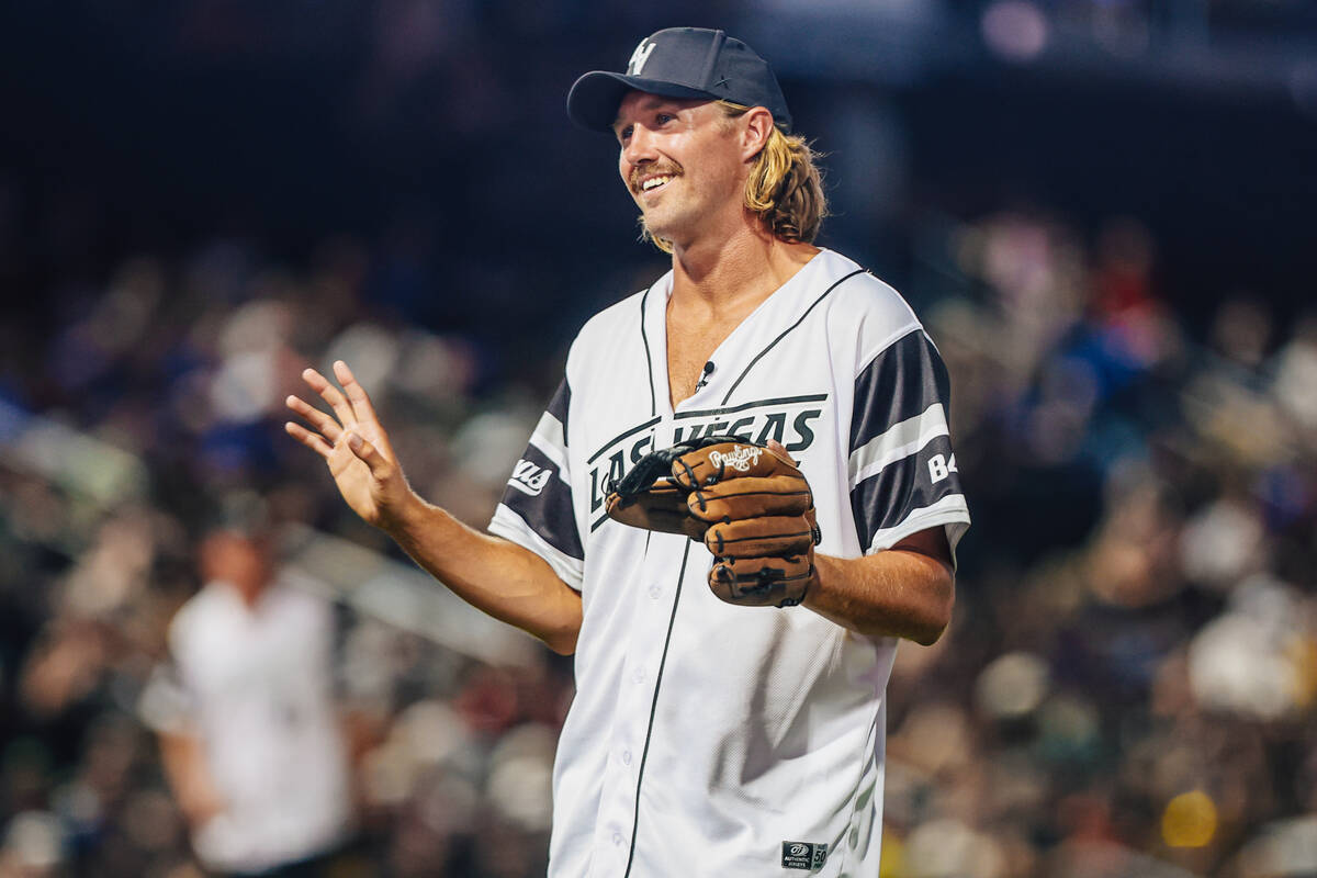 Raiders punter AJ Cole smiles during a Battle For Vegas charity softball game between Team Eich ...