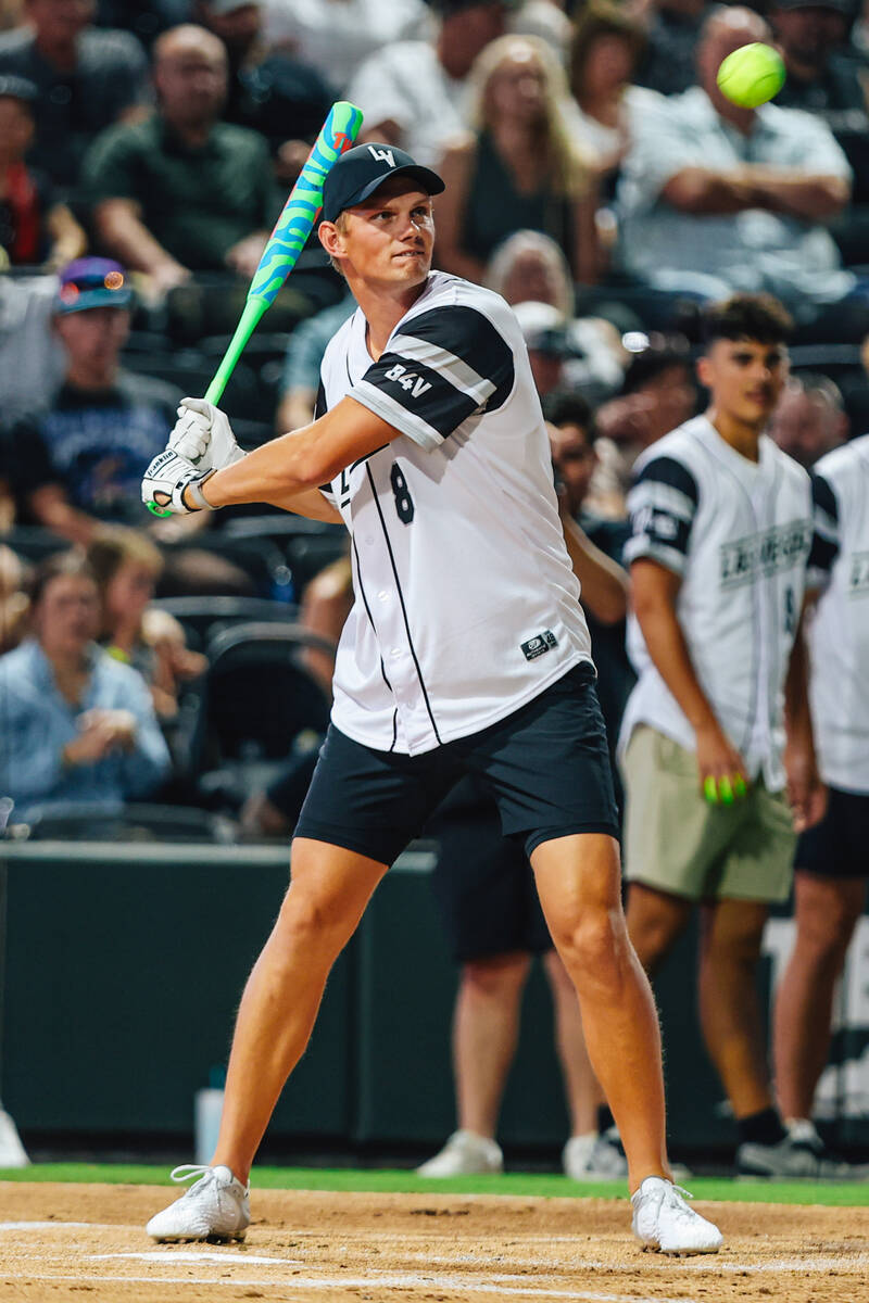 Raiders placekicker Daniel Carlson hits the ball during a Battle For Vegas charity softball gam ...