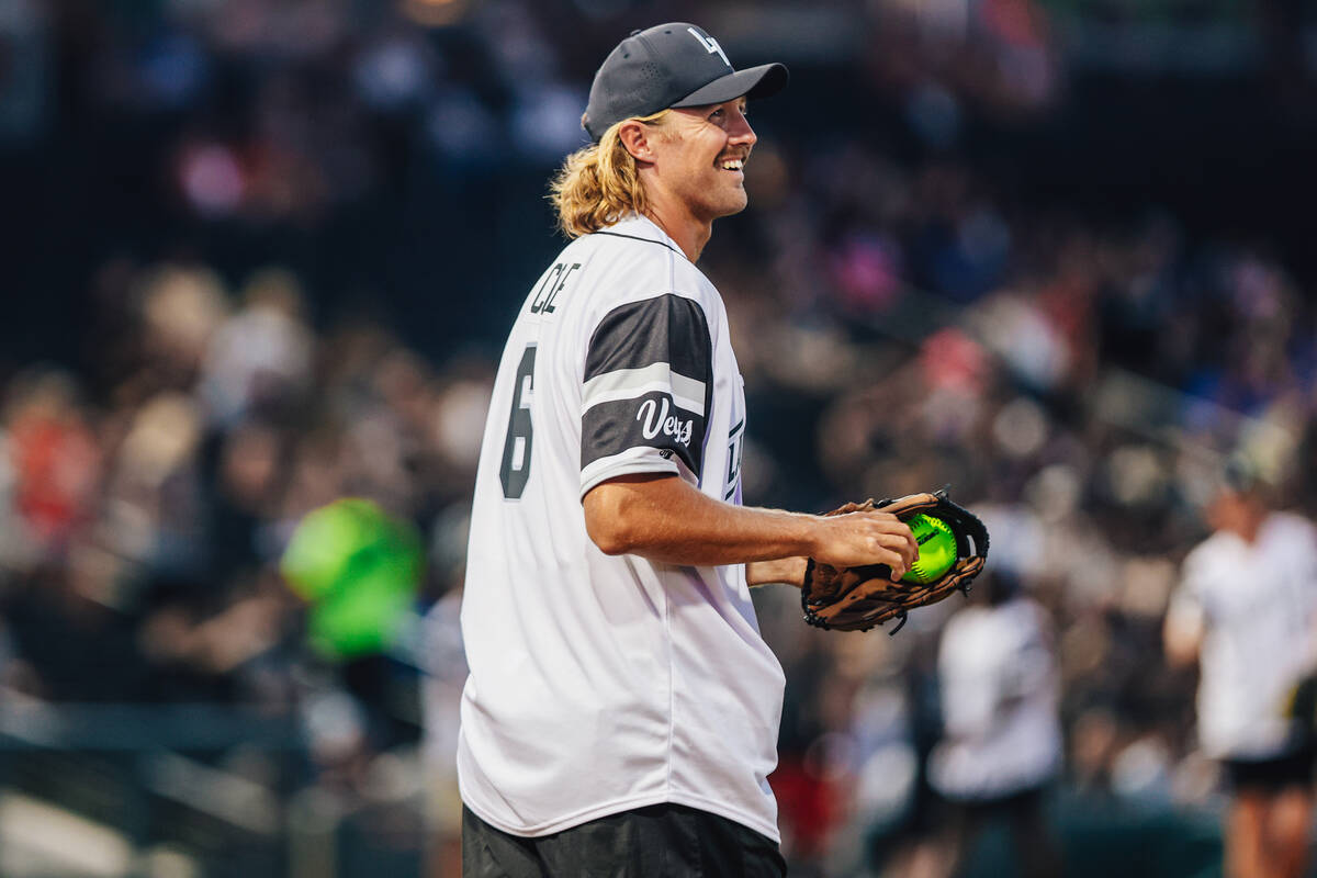 Raiders punter AJ Cole smiles during a Battle For Vegas charity softball game between Team Eich ...