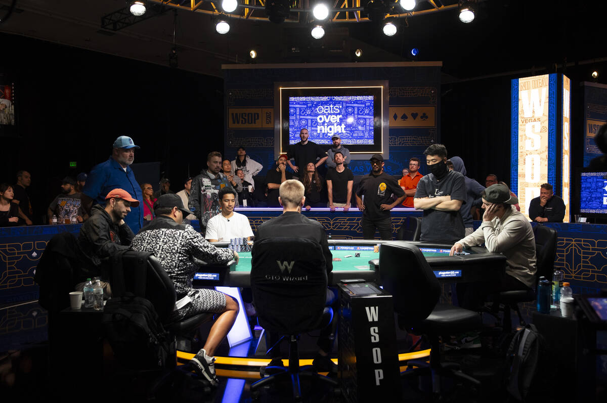 Daehyung Lee, right, stands after going all-in on a play during day 8 of the World Series of Po ...