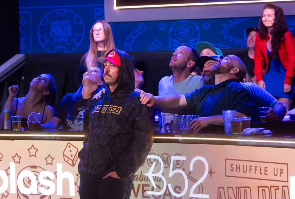 Jarod Minghini stands with supporters during a play on day 8 of the World Series of Poker Main ...