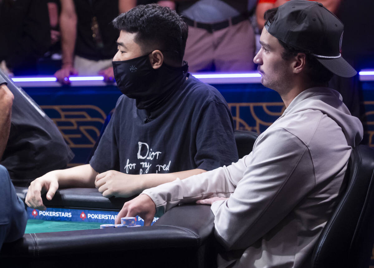 Joseph Ozimok , right, looks on during day 8 of the World Series of Poker Main Event at Horsesh ...