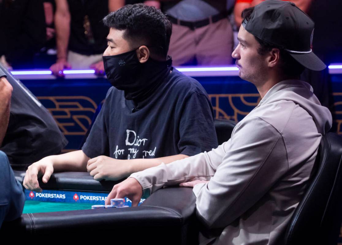 Joseph Ozimok , right, looks on during day 8 of the World Series of Poker Main Event at Horsesh ...
