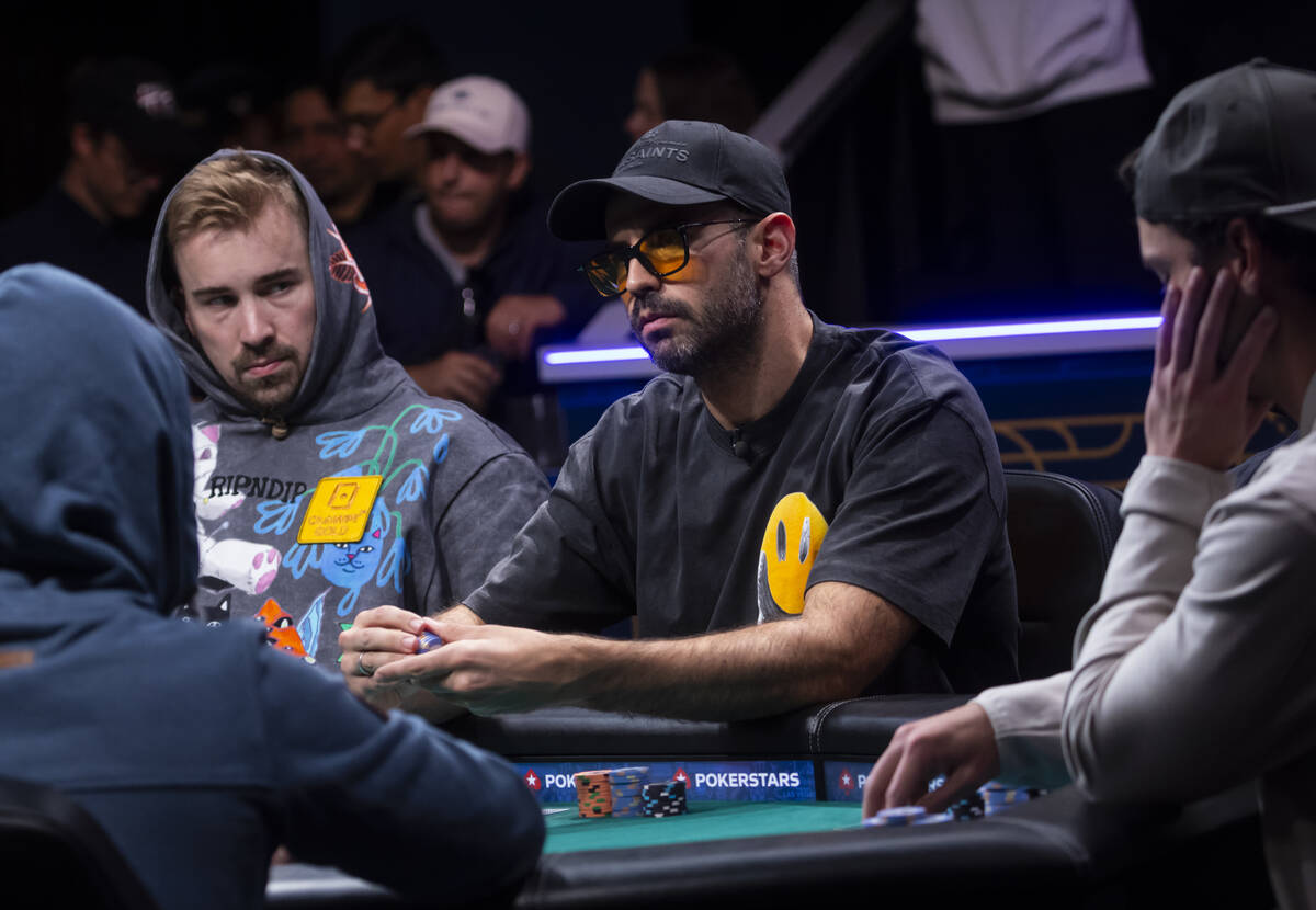 Lautaro Guerra, center, looks on during day 8 of the World Series of Poker Main Event at Horses ...