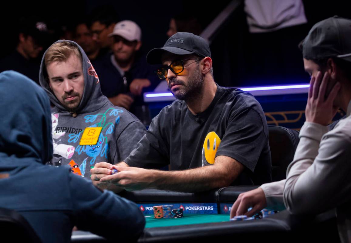 Lautaro Guerra, center, looks on during day 8 of the World Series of Poker Main Event at Horses ...