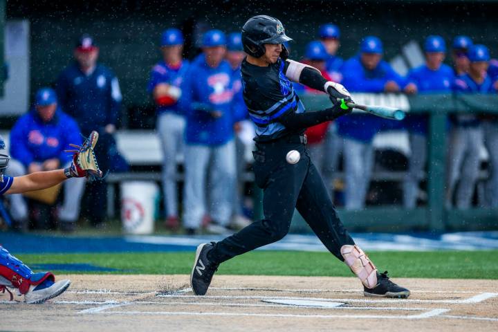 Basic batter Tate Southisene (8) only gets a piece of a pitch from a Reno pitcher in extra inni ...