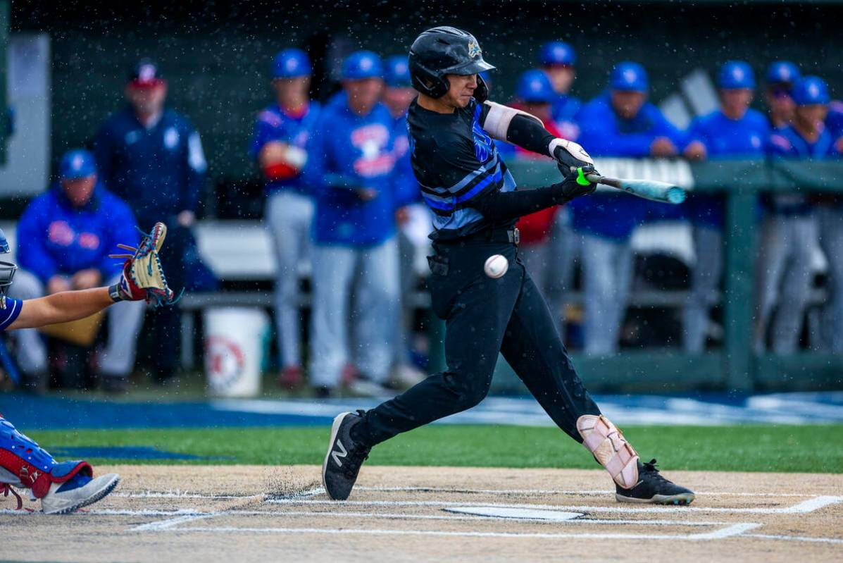 Basic batter Tate Southisene (8) only gets a piece of a pitch from a Reno pitcher in extra inni ...