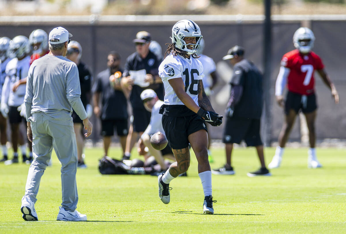 Raiders wide receiver Jakobi Meyers (16) looks to head coach Pete Carroll after a pass was thro ...