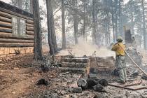 This photo provided by National Park Service shows the charred remains of a building at the Nor ...