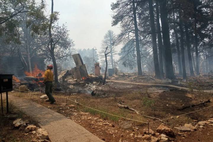 This photo shows the charred remains of a building at the North Rim of Grand Canyon National Pa ...