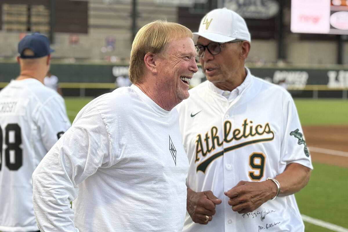 Raiders owner Mark Davis (left) and Athletics Hall of Famer Reggie Jackson have a conversation ...