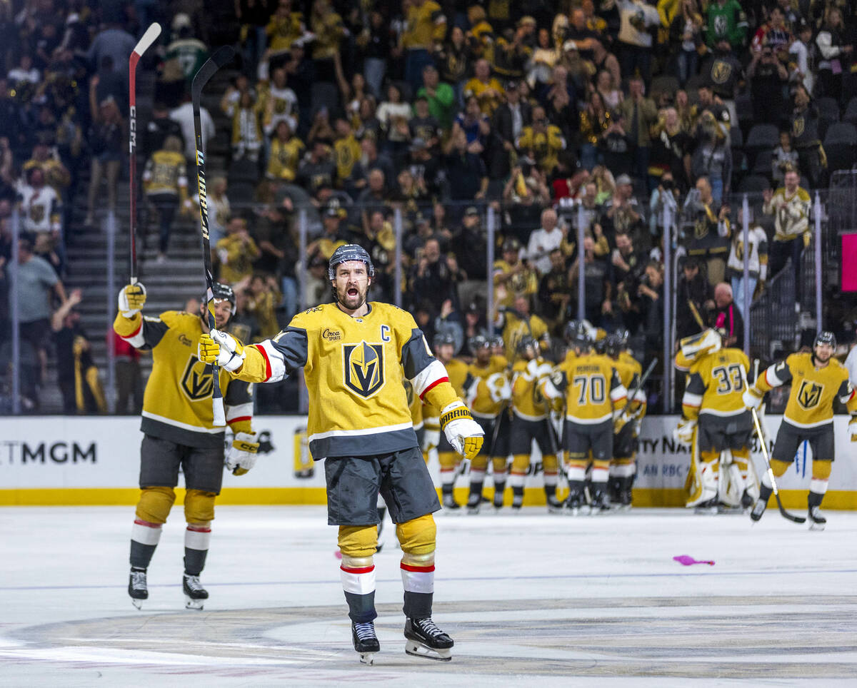 Golden Knights right wing Mark Stone (61) and teammates celebrate their goal and win against th ...