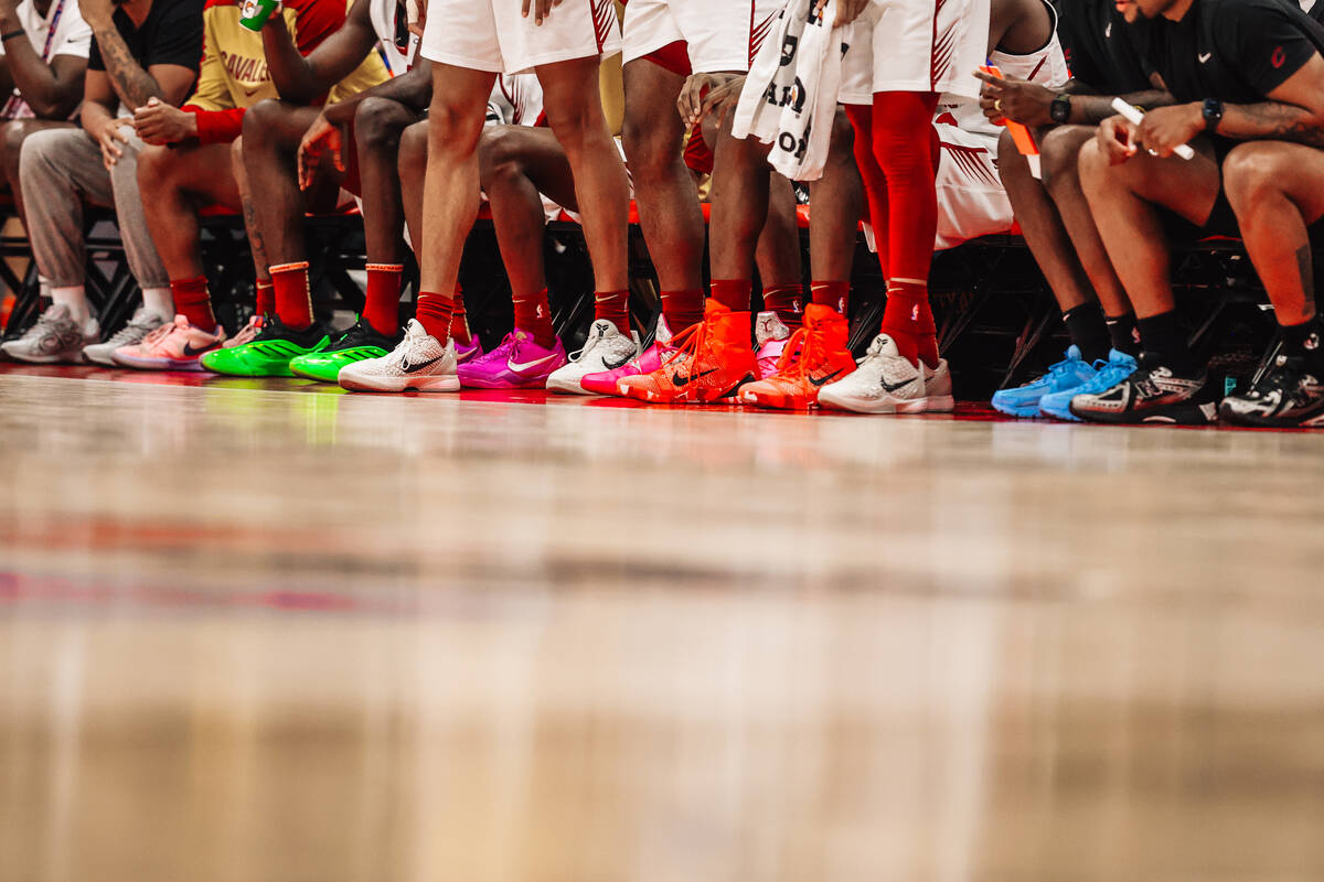 Cleveland Cavaliers players stand on the sidelines during an NBA Summer League basketball game ...