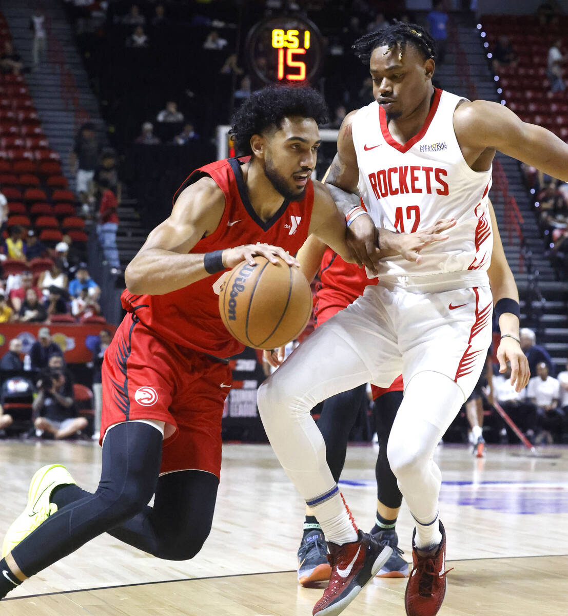 Atlanta Hawks forward Jacob Toppin (00) drives past Houston Rockets guard Adonis Arms (42) duri ...