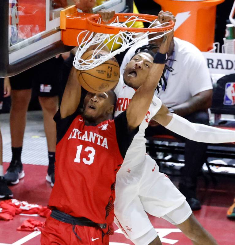 Atlanta Hawks forward Javan Johnson (13) dunks past Houston Rockets guard Kennedy Chandler (47 ...