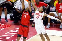 Atlanta Hawks forward Javan Johnson (13) dunks past Houston Rockets guard Kennedy Chandler (47 ...