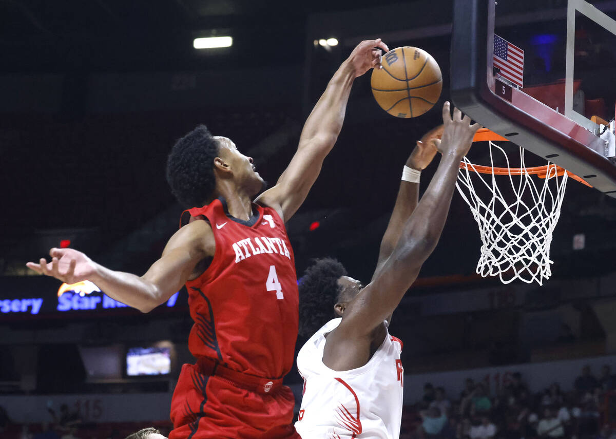 Atlanta Hawks guard Kobe Bufkin (4) blocks as Houston Rockets forward Great Osobor (54) tries t ...