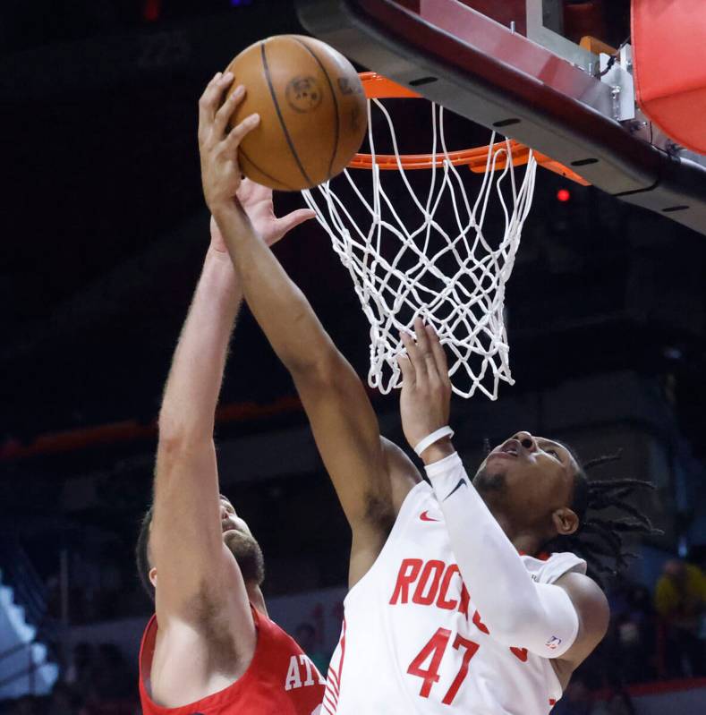 Houston Rockets guard Kennedy Chandler (47) makes makes a layup against Atlanta Hawks center Ja ...