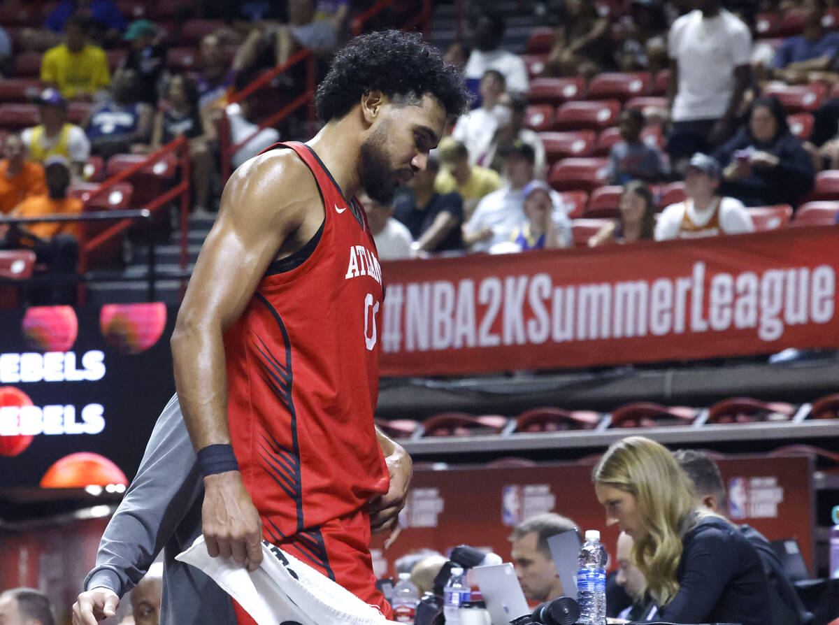 Atlanta Hawks forward Jacob Toppin, (00) leaves the floor after being injured during the NBA Su ...