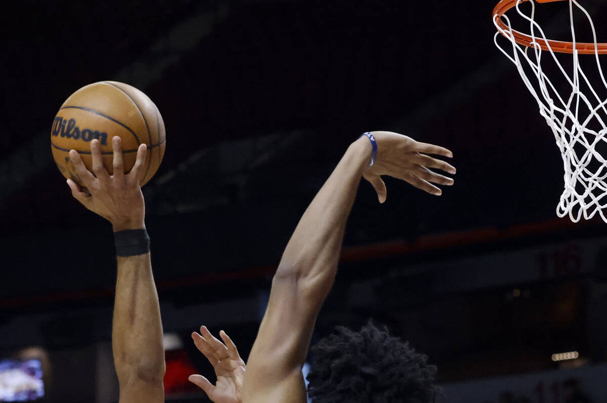 Houston Rockets forward Jermaine Samuels Jr., right, defends as Atlanta Hawks forward Jacob Top ...