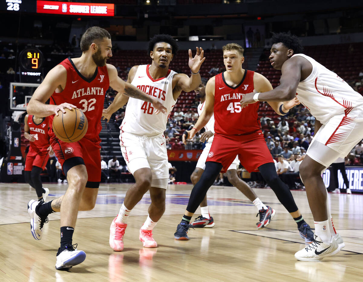Atlanta Hawks forward Jack McVeigh (32) drives past Houston Rockets forward Jermaine Samuels Jr ...