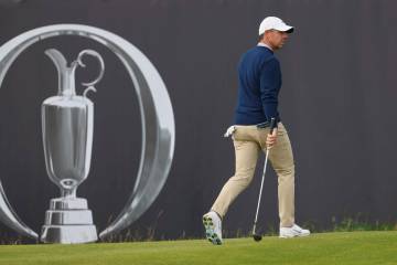 Rory McIlroy of Northern Ireland reacts after putting on the 12th green during a practice round ...