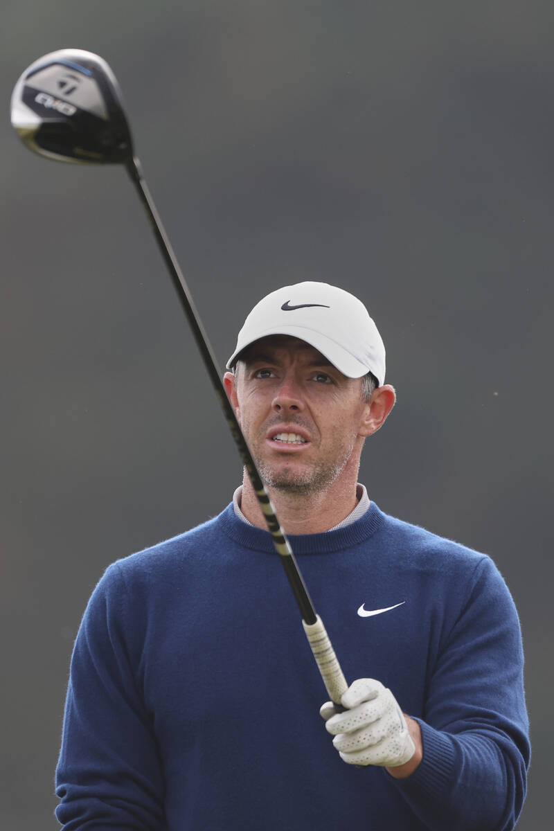Rory McIlroy of Northern Ireland prepares to play the off 12th tee during a practice round for ...