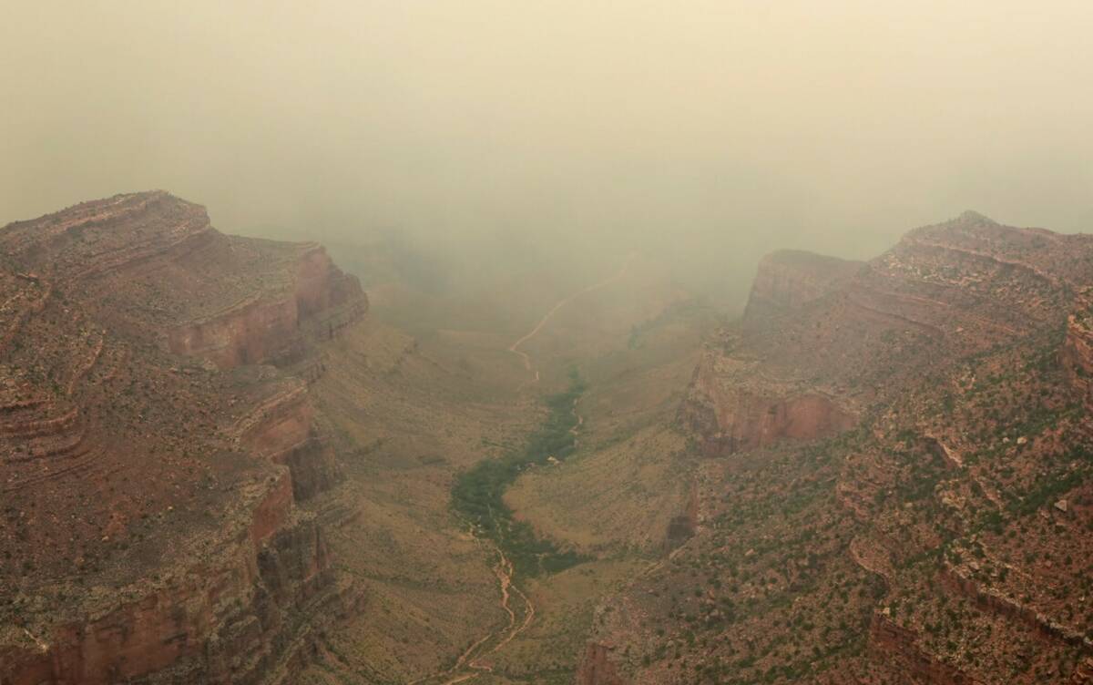 Smoke from the Dragon Bravo Fire moves over the Grand Canyon from the North Rim, Monday, July 1 ...