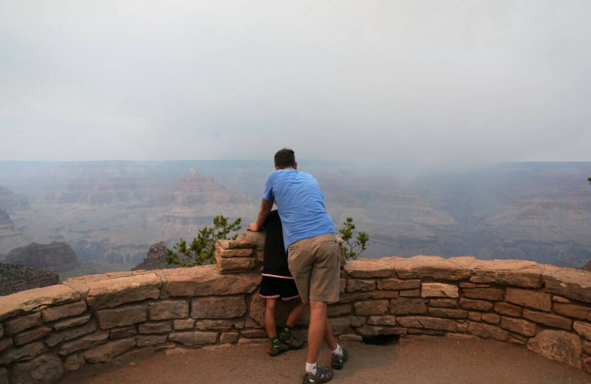 Smoke from the Dragon Bravo Fire moves over the Grand Canyon from the North Rim, Monday, July 1 ...